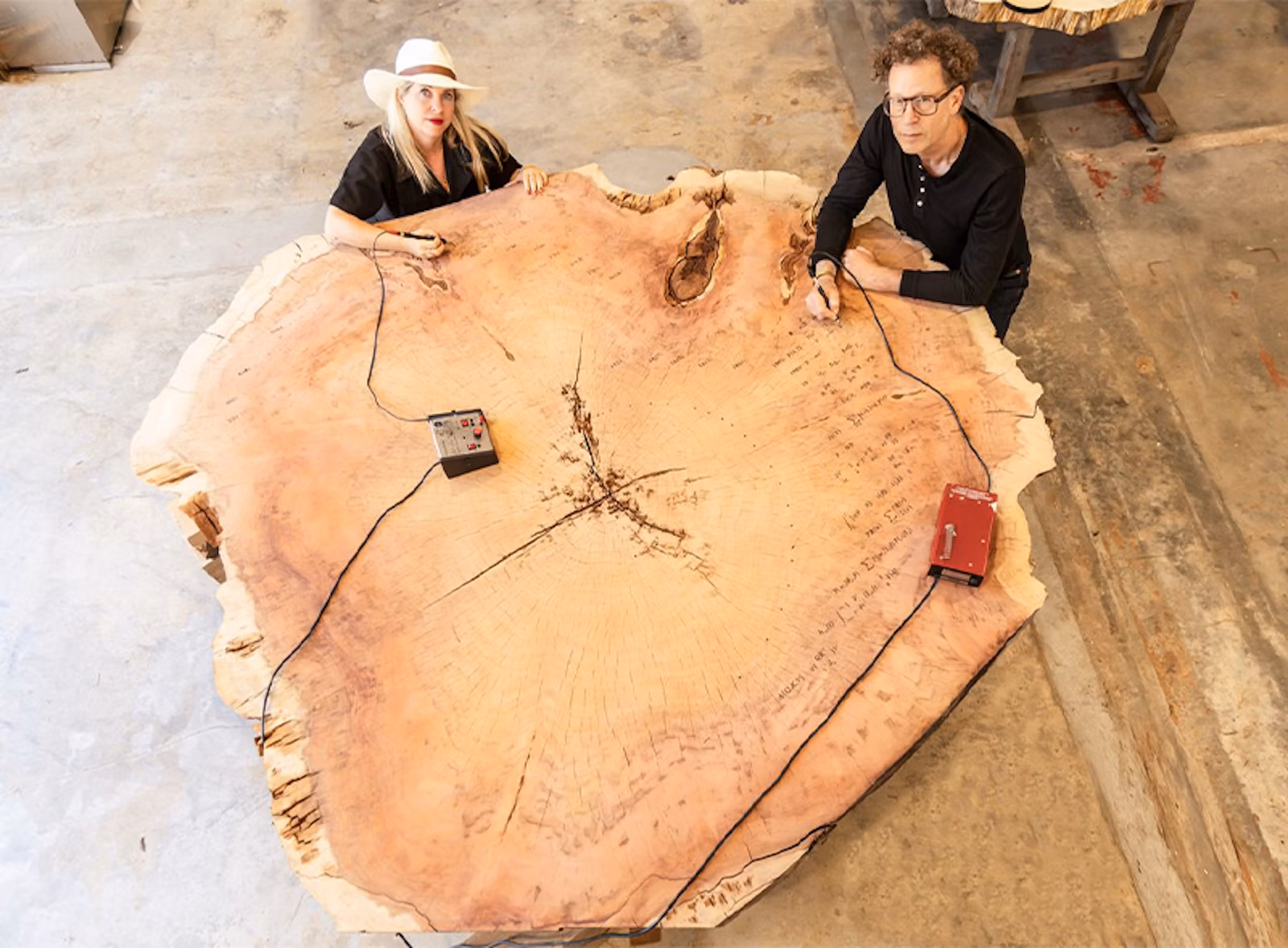 ABSTRACT EXPRESSION: Artist Tiffany Shlain and her husband, roboticist Ken Goldberg, inscribe equations in the shape of a golden spiral on a slab of redwood