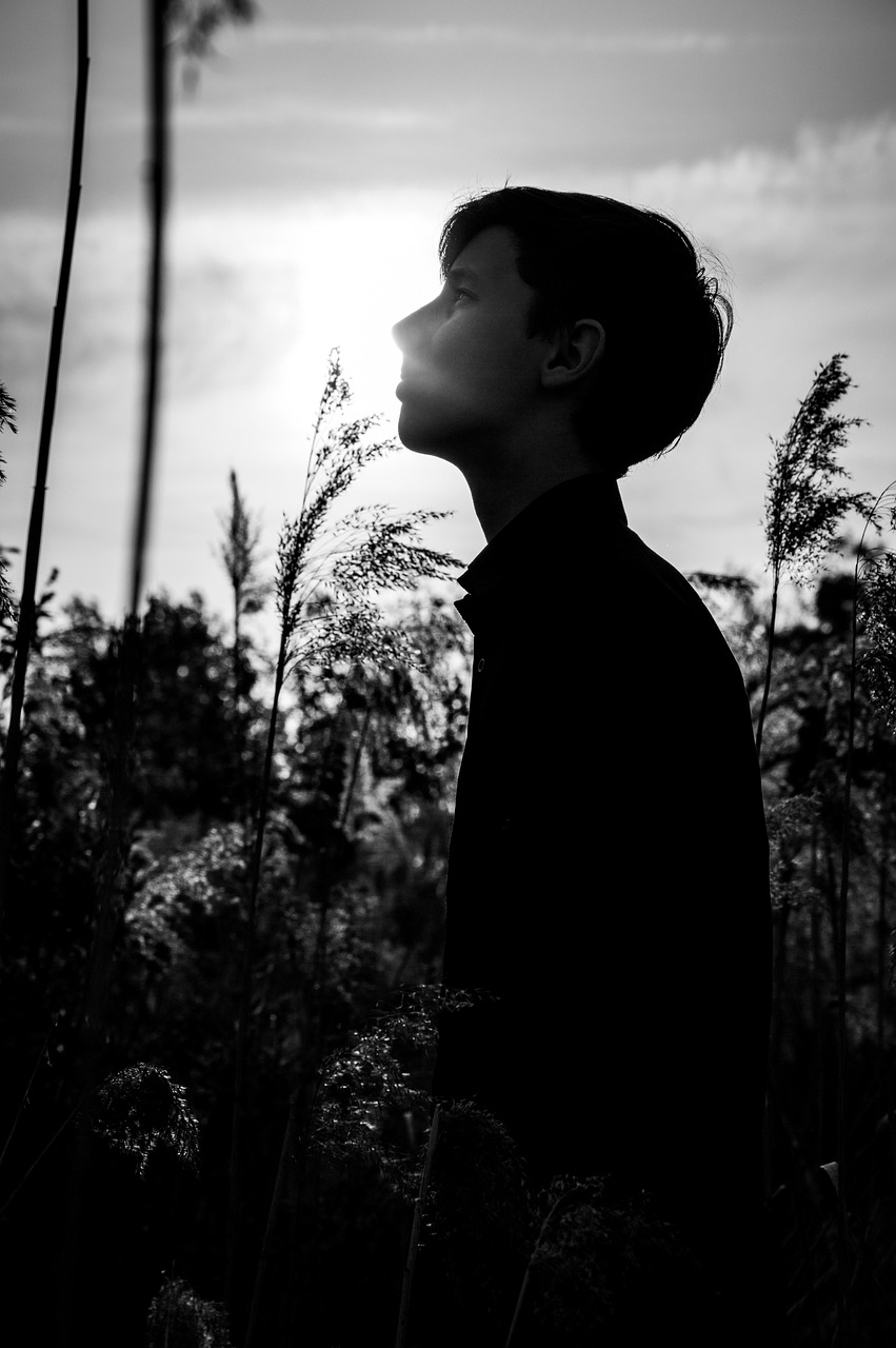 young man teen grass reeds