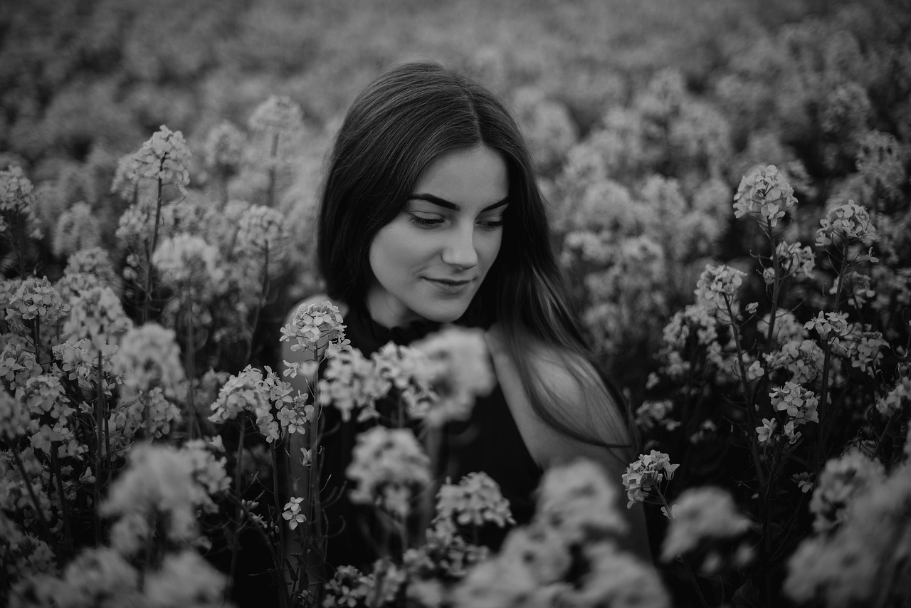 Woman Smelling Flowers