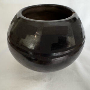 Pueblo Blackware on black pot with etched geometric designs